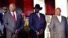 From left, South Sudan opposition leader Riek Machar, South Sudan's President Salva Kiir and Uganda's President Yoweri Museveni pose for a photo at the State House in Entebbe, Uganda, Nov. 7, 2019.