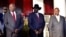 From left, South Sudan opposition leader Riek Machar, South Sudan's President Salva Kiir and Uganda's President Yoweri Museveni pose for a photo at the State House in Entebbe, Uganda, Nov. 7, 2019.