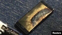 FILE - A burned Samsung Note 7 smartphone belonging to Brian Green is pictured in this undated handout photo obtained by Reuters.