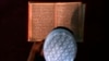 FILE - An Afghan boy reads the Quran in a madrassa or religious school in Kabul.