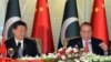 Chinese President Xi Jinping, left, and Pakistan's Prime Minister Nawaz Sharif address reporters at the prime minister's house in Islamabad, April 20, 2015.