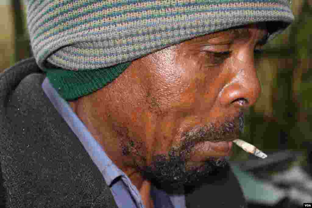 Ikhaya Loxolo’s maintenance man, Patekile Mofeti, is one of the few people able to control Sisa and to calm him when he’s agitated (VOA/ D. Taylor) (VOA/ D. Taylor) 