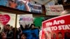 FILE - Immigrant rights advocates demonstrate against President-elect Donald Trump's immigration policies during a rally at Metropolitan AME Church in Washington, Jan. 14, 2017.