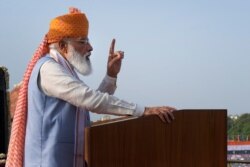 FILE - Indian Prime Minister Narendra Modi addresses the gathering during Independence Day celebrations at the historic 17th century Red Fort in New Delhi, India, Aug. 15, 2021.