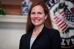 Judge Amy Coney Barrett, President Donald Trumps nominee for the U.S. Supreme Court, meets with Sen. Cindy Hyde-Smith, R-Miss., on Capitol Hill in Washington, Wednesday, Sept. 30, 2020. (Oliver Contreras/Pool via AP)