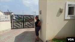 Torkwase Kuraun stands at the spot were her brother, journalist Tordue Salem, was standing the morning of Oct. 13, 2021, the she last time she saw him, Nov. 04, 2021. (T. Obiezu/VOA)