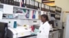 A lab technician assists in the superinfection study in Rakai, Uganda. (NIAID)
