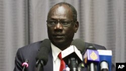 South Sudanese information minister, Michael Makuei Lueth, shown here at a news conference in Addis Ababa last year, says South Sudan needs to restore peace before the alleged perpetrators of violence in the conflict can be held accountable. 