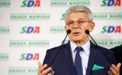 FILE - Sefik Dzaferovic of the Party of Democratic Action attends a news conference in Sarajevo, Bosnia and Herzegovina, Oct. 7, 2018.