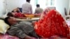 In this May 6, 2018, photo provided by Cambodia National Police, patients lie on beds at a hospital in Kratie province in northeast of Phnom Penh, Cambodia.