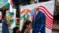 Children from an art school make paintings of U.S. President Donald Trump ahead of his India visit, in Mumbai, India, Feb. 21, 2020.