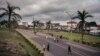 FILE - People walk by the entrance of the University of Buea, South-West Region of Cameroon, on April 27, 2018.
