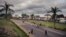 FILE - People walk by the entrance of the University of Buea, South-West Region of Cameroon, on April 27, 2018.