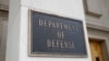 FILE - A photo shows a sign for the Department of Defense at the Pentagon building, in Arlington, Virginia, outside Washington, April 19, 2019. 