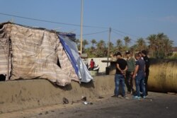 Protesters block the main road into Tripoli, Lebanon, Nov. 15, 2019. (Heather Murdock/VOA)
