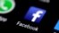 FILE: The Facebook icon is seen on a phone screen, Aug. 3, 2017. 