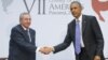 U.S. President Barack Obama and Cuban President Raul Castro meet for an informal talk on the sidelines of the Summit of the Americas in Panama City, April 11, 2015. 