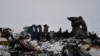A wreckage of a U.S. military aircraft that crashed in Ghazni province, Afghanistan, is seen Monday, Jan. 27, 2020. 