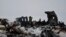 A wreckage of a U.S. military aircraft that crashed in Ghazni province, Afghanistan, is seen Monday, Jan. 27, 2020. 