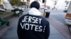 A voter wears a message on his jacket on Election Day, Nov. 6, 2012, in Hoboken, N.J. 
