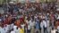 Protesters march near the scene of Saturday's massive truck bomb attack in Mogadishu, Somalia, Oct. 18, 2017. 