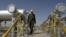 Iranian oil technician Majid Afshari makes his way at the oil separator facilities in Azadegan oil field, near Ahvaz, Iran (File).