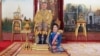 This undated photo posted Monday, Aug. 26, 2019 on the Thailand Royal Office website shows King Maha Vajiralongkorn with Major General Sineenatra Wongvajirabhakdi, the royal noble consort. She was bestowed the title of Chao Khun Phra Sineenatra Bilasakalayani in late July. 