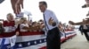 Republican presidential candidate, former Massachusetts Gov. Mitt Romney gestures as he greets supporters as he arrives at a Florida campaign rally at Orlando Sanford International Airport, in Sanford, Fla., Nov. 5, 2012. 