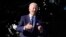 President Joe Biden speaks to reporters on the South Lawn of the White House, Oct. 18, 2021, in Washington.