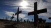 Crosses fill a graveyard in Cape Town's Khayelitsha township February 27, 2010. Many of those buried in the South African cemetery died from AIDS or related complications such as tuberculosis (TB).