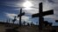 Crosses fill a graveyard in Cape Town's Khayelitsha township February 27, 2010. Many of those buried in the South African cemetery died from AIDS or related complications such as tuberculosis (TB).