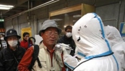 People being tested Tuesday for radiation exposure in Koriyama city near the damaged Fukushima nuclear power plant