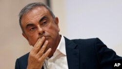 FILE - In this Sept. 29, 2020, file photo, former Nissan Motor Co. Chairman Carlos Ghosn holds a press conference at the Maronite Christian Holy Spirit University of Kaslik, as he launches an initiative to help Lebanon that is undergoing a severe…
