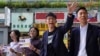 Election winner candidate Kelvin Lam, right, and pro-democracy activist Joshua Wong, second right, wave to people and thank for their support, outside South Horizons Station in Hong Kong, Monday, Nov. 25, 2019. Pro-democracy candidates won nearly…