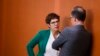 Christian Democratic Union party chairwoman and Defense Minister Annegret Kramp-Karrenbauer talks with Foreign Minister Heiko Maas prior to the weekly cabinet at the chancellery in Berlin, Feb. 12, 2020. 