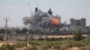 FILE - Smoke and flame rise after what fighters of the Syria Democratic Forces said were U.S.-led airstrikes on the mills of Manbij where Islamic State militants are positioned, in Aleppo Governorate, Syria, June 16, 2016. 