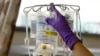 FILE - A nurse places chemotherapy medication on an intravenous stand at the Fox Chase Cancer Center in Philadelphia.