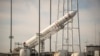 The Orbital Science Corporation Antares rocket is seen as it is raised into position at launch Pad-0A at NASA's Wallops Flight Facility, Wallops Island, Virginia, Dec. 17, 2013.