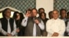 Former Prime Minister and leader of the Pakistan Muslim League-N party Nawaz Sharif, center, addresses his supporters at a party office in Lahore, May 11, 2013.