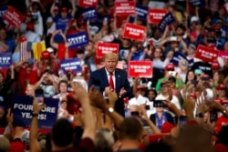 FILE - President Donald Trump reacts to the crowd after speaking during his re-election kickoff rally at the Amway Center, in Orlando, Florida, June 18, 2019.
