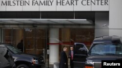 Members of the Secret Service stand outside New York-Presbyterian Hospital where U.S. Secretary of State Hillary Clinton remains hospitalized, January 1, 2013. 