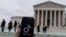 The TikTok logo is displayed on a mobile phone next to the U.S. Supreme Court, in this picture illustration
