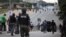 FILE - Nigerian police officers patrol in the streets of Abuja during clashes with members of the Shi'ite Islamic Movement of Nigeria, July 22, 2019. 
