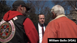 Virginia gubernatorial candidate Corey Stewart (rear, center) is seen at an “End Sanctuary Cities Rally” in Richmond, Virginia, March 2017. Stewart is using President Donald Trump as a model for his race to win the Republican Party nomination for governor of Virginia.