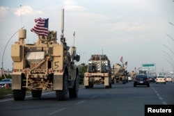 A convoy of U.S. vehicles is seen after withdrawing from northern Syria, in Erbil, Iraq, Oct. 21, 2019.