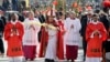Pope Francis holds a palm frond as he celebrates a Palm Sunday Mass in St. Peter's Square at the Vatican, March 25, 2018.