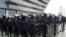 Thai riot policemen stand guard outside the Constitution Court during a ruling Friday, July 13, 2012 in Bangkok, Thailand.