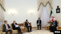 This aerial picture shows a giant roll of more than 2500 laminated postcards displayed for an exhibit test of an action against climate change, in the Aletsch Glacier near the Jungfraujoch in the Swiss Alps.