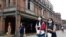 People wearing face masks to help curb the spread of the coronavirus walk on a street in Taipei, Taiwan, Oct. 19, 2020. (AP)
