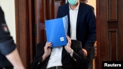 Bruno D., 93, a German accused of being an SS guard involved in killings of prisoners between August 1944 and April 1945 in the Stutthof Nazi concentration camp near Gdansk, leaves a courtroom in Hamburg, Germany July 23, 2020.
